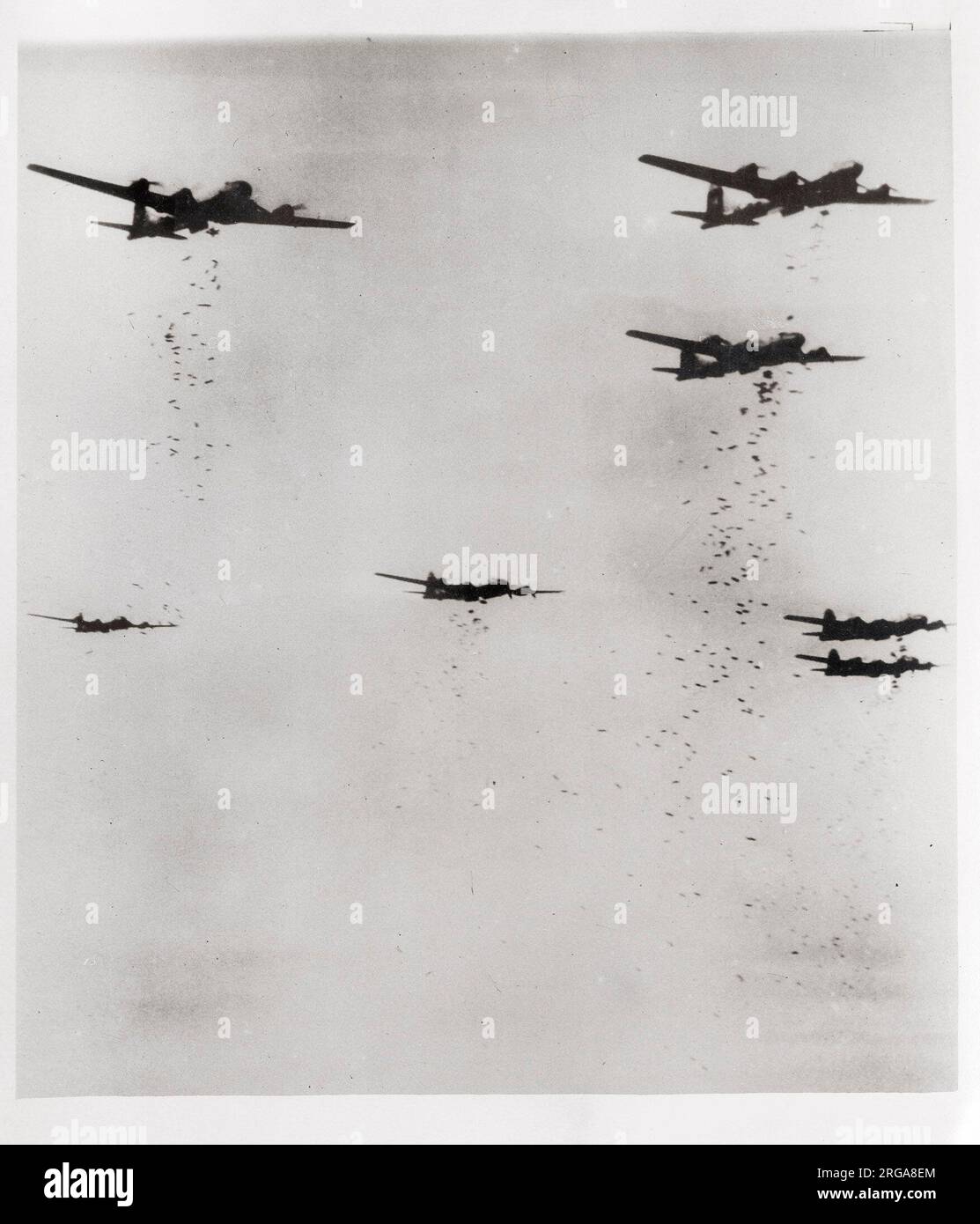 Vintage World War II photograph - incendiary bombs shower from B-29 Superfortress aircraft over the Japanese city of Yokohama Stock Photo
