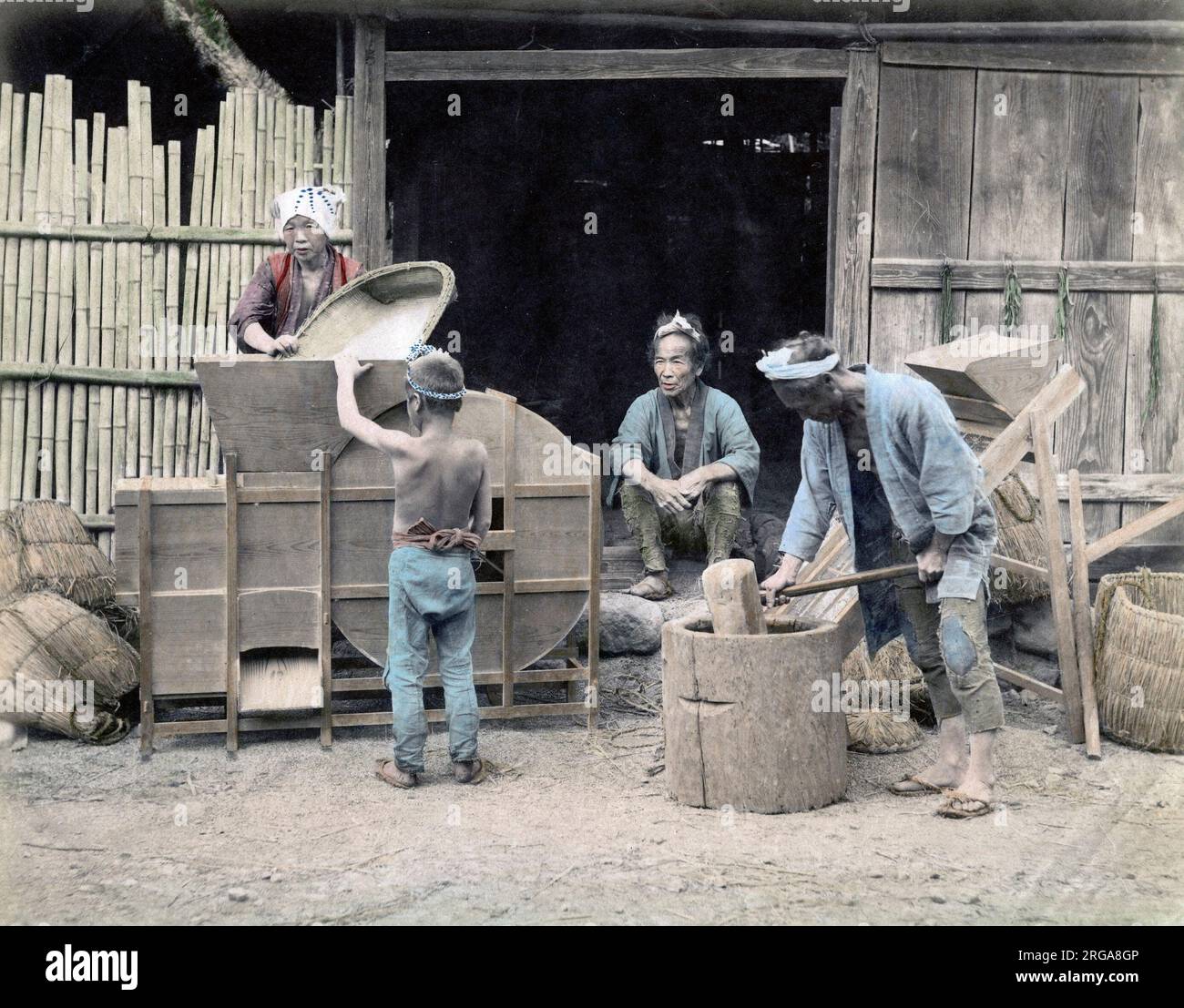 c.1880s Japan - cleaning and pounding rice Stock Photo