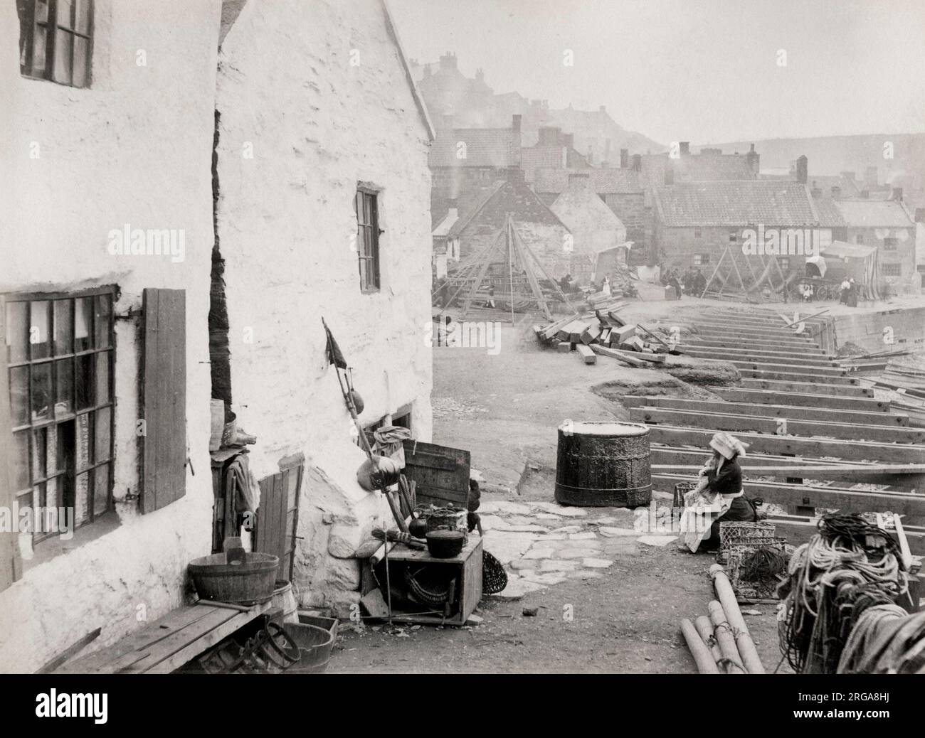 Buidling work along the seafront in the fishing village of Staithes, Yorkshire. Vintage 19th century photograph. Stock Photo