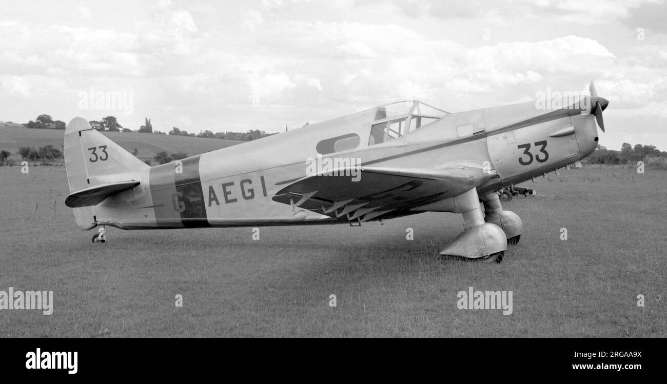 Parnall Heck 2C G-AEGI, seen with race number 33 at Elmdon for the 1949 King's Cup Air Race. On 29 July 1949, G-AEGI flew in the King's Cup Race at Elmdon airport, finishing 13th at an average speed of 145.5 mph. The following year it flew into 7th place in the same event, held at Wolverhampton (with race number 26), and actually averaged 159 mph as it had done in 1938. Unfortunately this Heck 2C was severely damaged after the race when Spitfire G-AISU collided with it during the Spitfire's landing run. The Heck's rear end was smashed, and it was put into a hangar at Wolverhampton, where it la Stock Photo