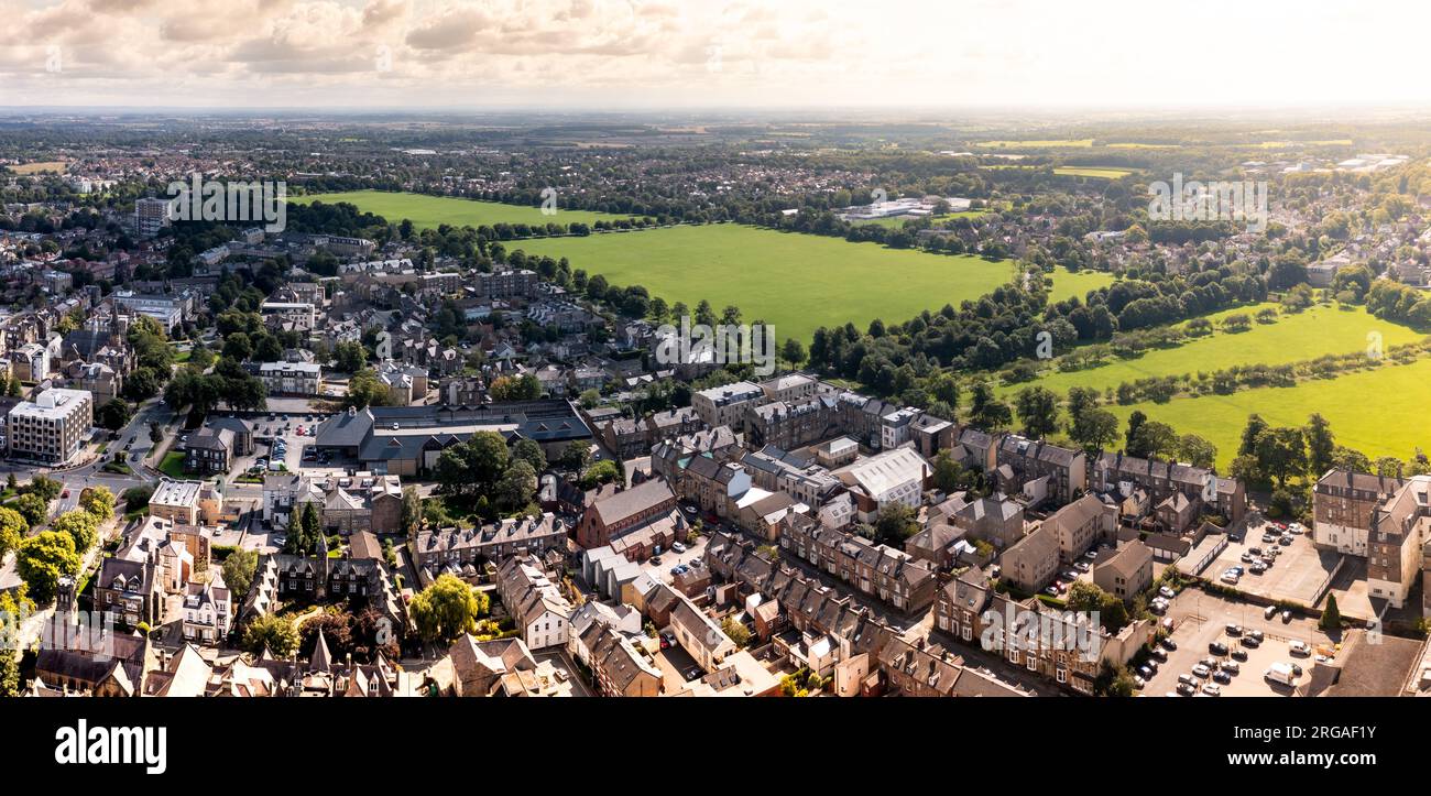 An aerial cityscape of Harrogate town with The Stray public park and Victorian architecture at sunset Stock Photo
