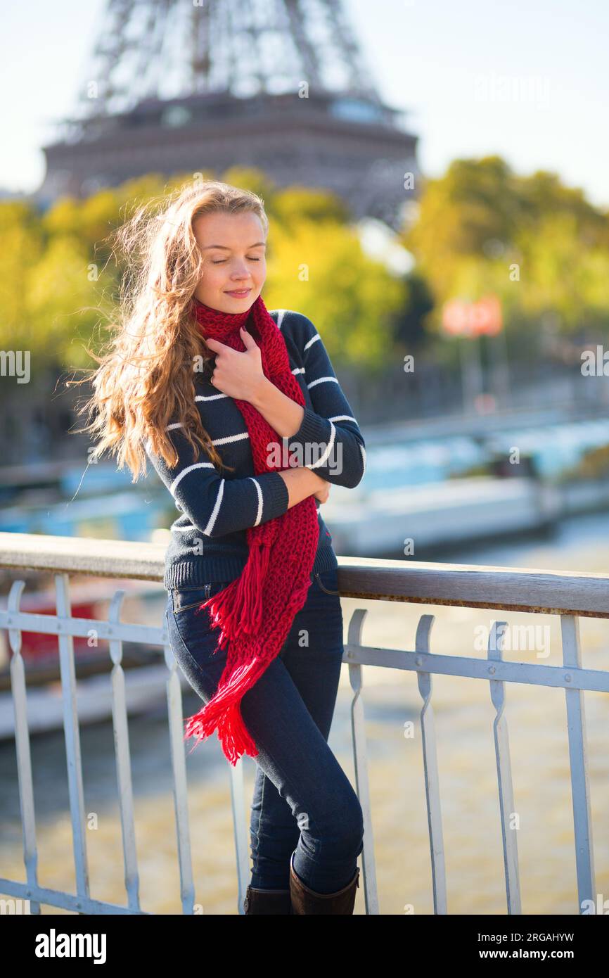 Parisian girl walking near the Eiffel tower Stock Photo - Alamy