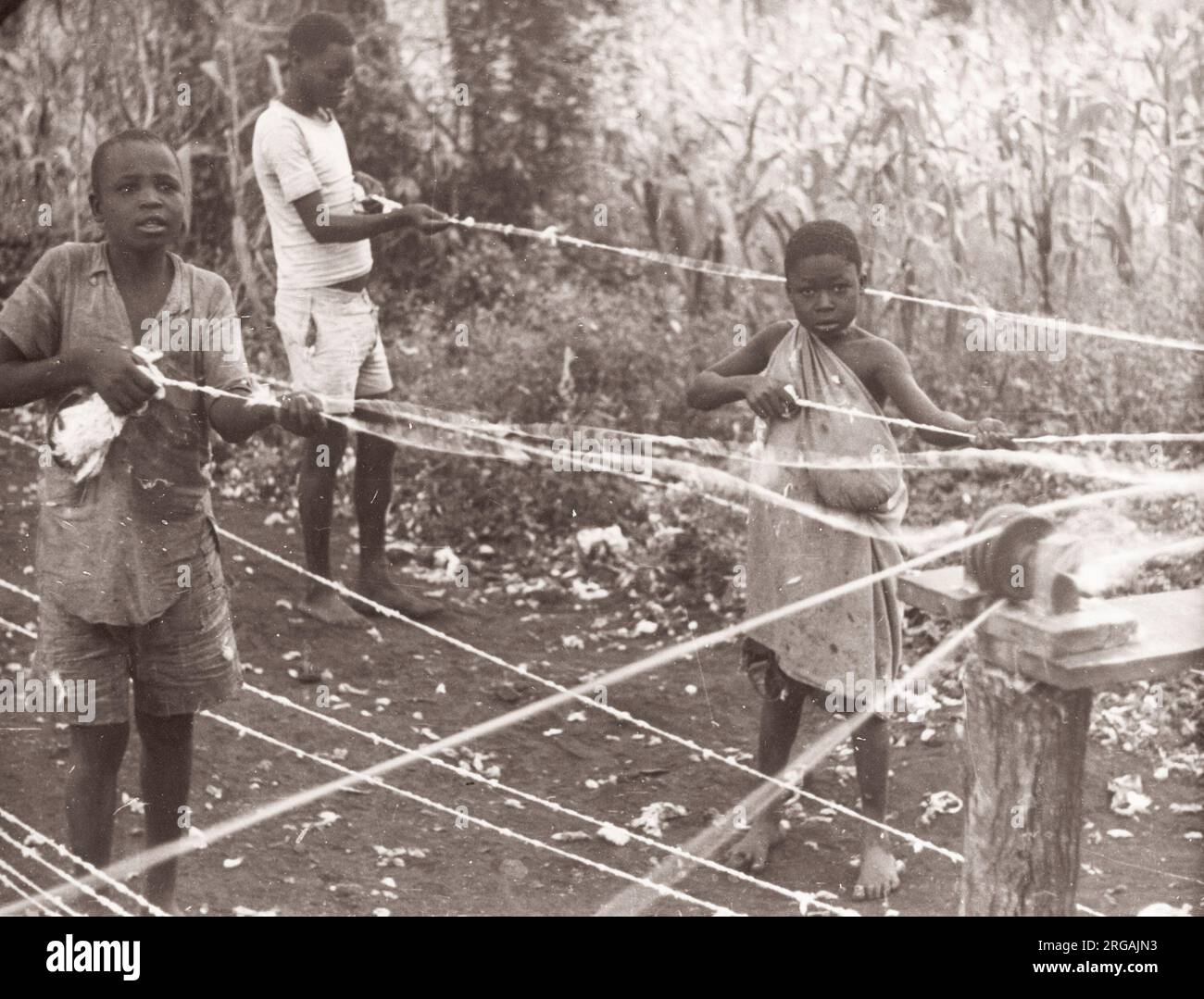 1940s East Africa - Kenya or Uganda - children making sisal rope Photograph by a British army recruitment officer stationed in East Africa and the Middle East during World War II Stock Photo