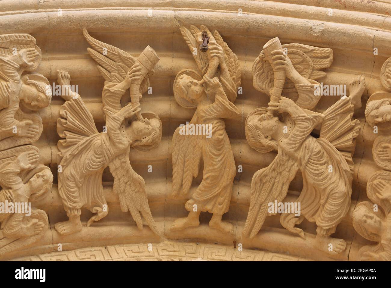 Sculptures with biblical symbolism, angels with trumpets, trumpets sounding on the tympanum, St-Trophime Church, Arles, Provence, Ste-Anne, Place de l Stock Photo