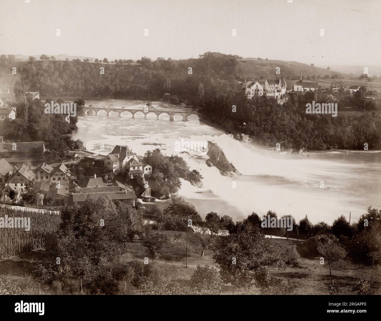Vintage 19th century photograph: Switzerland, c.1880's - Rhine Falls. The Rhine Falls is a waterfall located in Switzerland and the most powerful waterfall in Europe. The falls are located on the High Rhine on the border between the cantons of Schaffhausen and Zorich Stock Photo