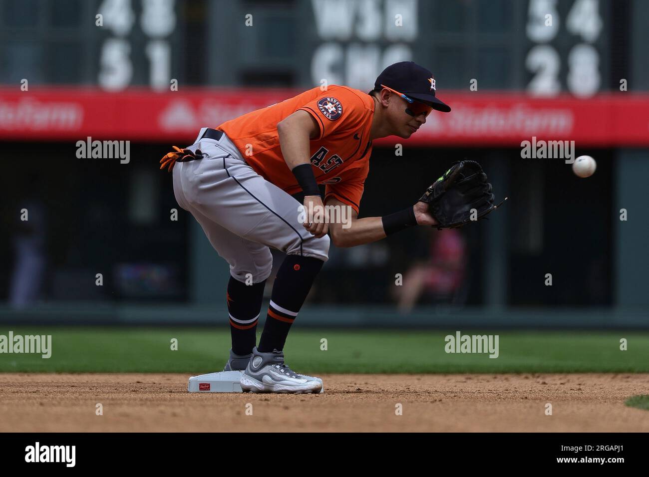 Houston Astros second baseman Mauricio Dubon (14) catches the ball at  second base in an MLB game against the Colorado Rockies. The Astros  defeated the Rockies 4-1, Wednesday, July 19, 2023, in