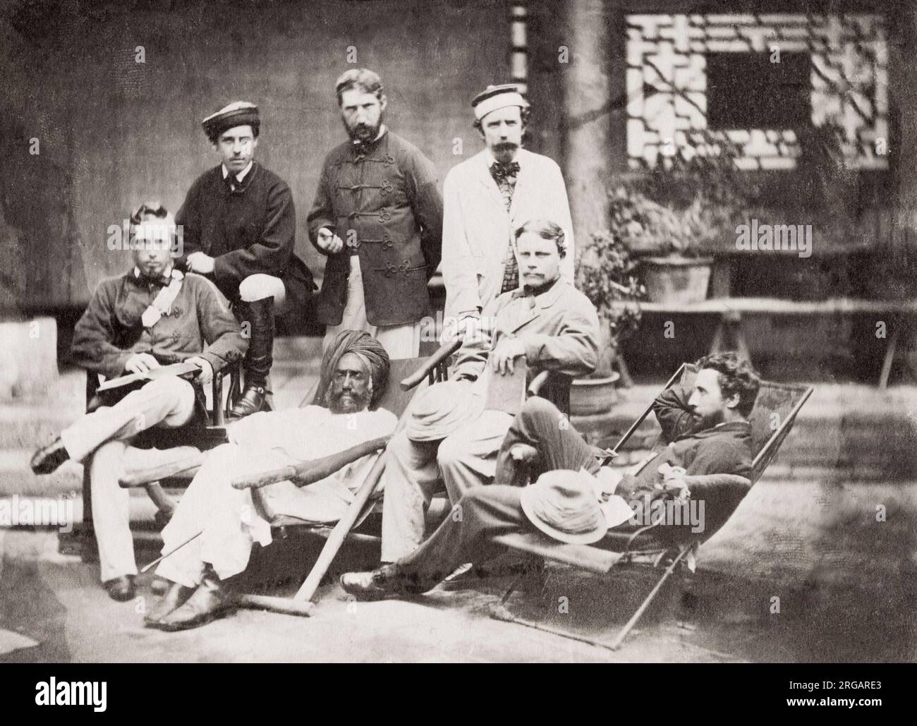 Vintage 19th century photograph: Officers of Fane's Horse, raised  by Captain Walter Fane at Cawnpore in 1860 for service in the Second Opium War in China. It became the 19th Lancers, a cavalry regiment of the British Army. Fane is the seated man with the book in his hand mid right. Image taken at Tientsin, Tianjin, China in 1861. Stock Photo