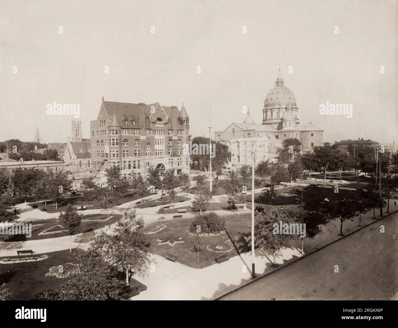 19th century vintage photograph - Mary, Queen of the World Cathedral or in full Mary, Queen of the World and St. James the Great Cathedral, Montreal, and YMCA buidling, image c.1890, Canada. William Notman studio. Stock Photo