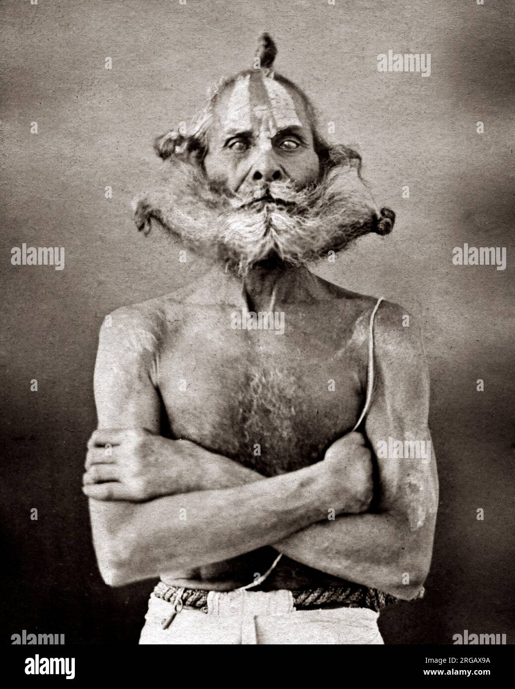 Vintage 19th century photograph: Indian man with specatacular facial hair, beard, moustache, whiskers, India, c.1880's Stock Photo