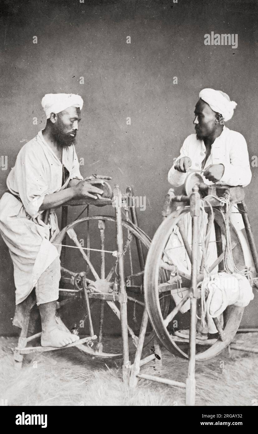 Vintage 19th century photograph: men with grinding stones sharpening knives, Egypt. Stock Photo