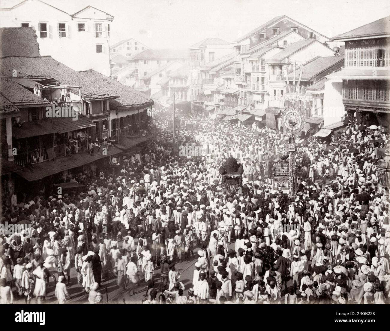 Vintage 19th century photograph: street procession, large crowd, Bombay, Mumbai, India. Stock Photo