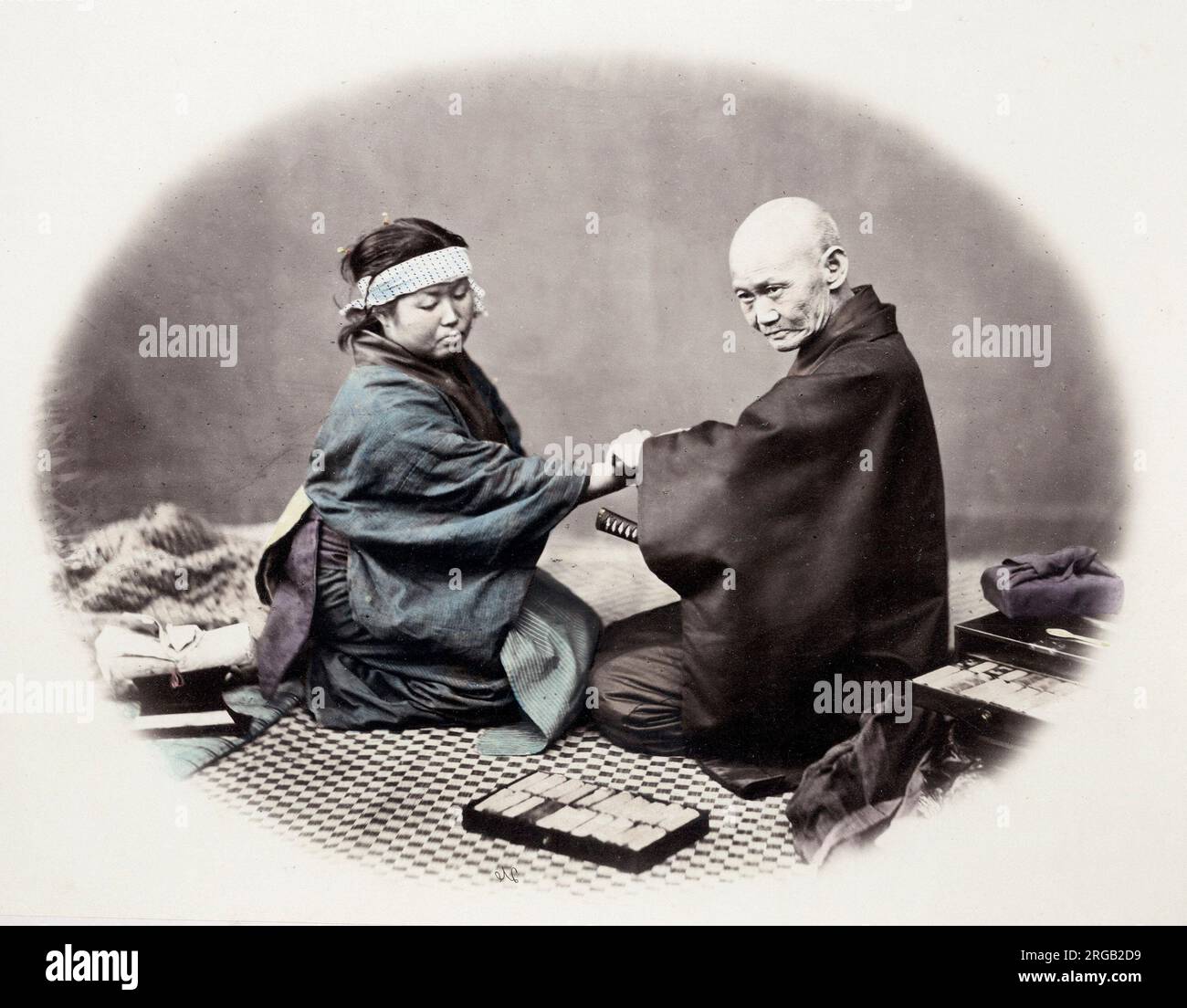 1860's Japan - portrait of a doctor and his patient Felice or Felix Beato (1832 - 29 January 1909),  Italian-British photographer working mostly in India, Japan, China Stock Photo