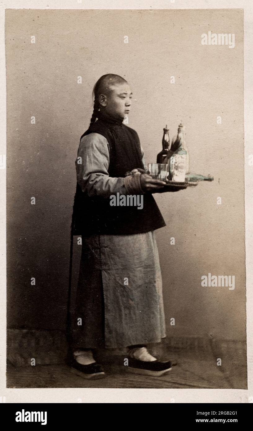 Vintage 19th century photograph: John Thomson carte de visite China: servant boy Stock Photo