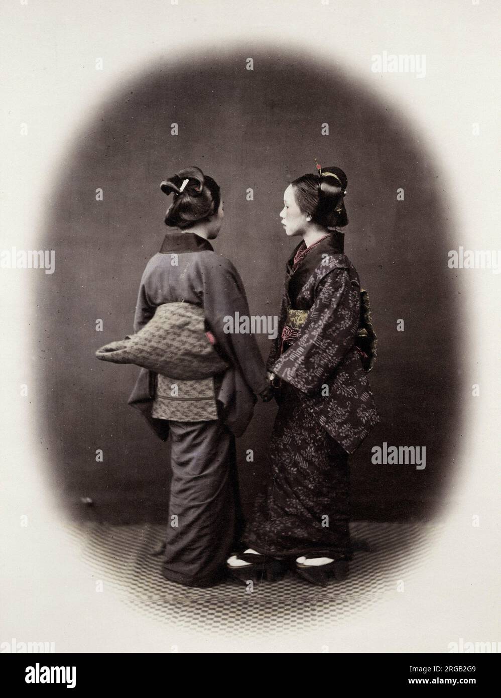 1860's Japan - portrait of two young women in ornate kimonos and obi sash Felice or Felix Beato (1832 - 29 January 1909),  Italian-British photographer working mostly in India, Japan, China Stock Photo
