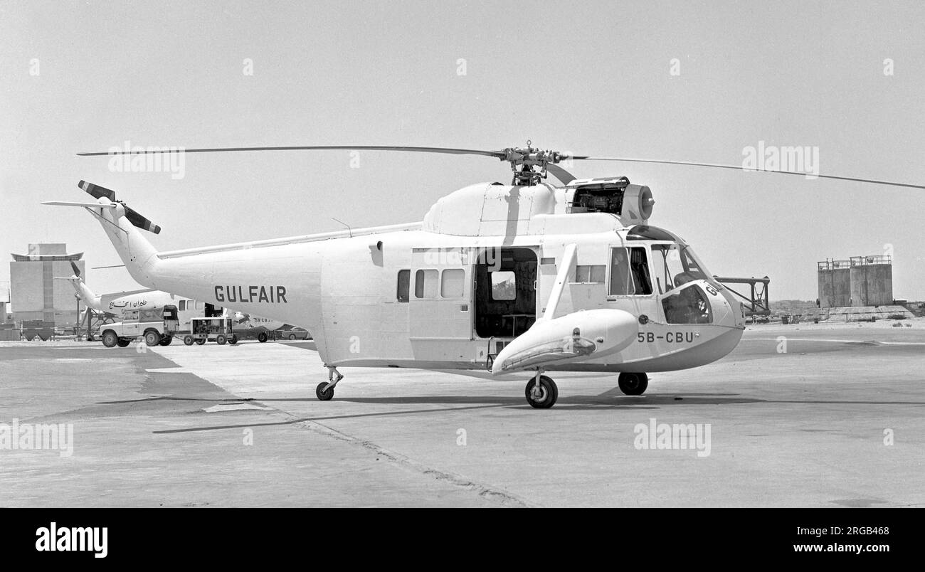 Sikorsky S-62A 5B-CBU (msn 62-107), of Gulf Helicopters, at Doha International Airport, (registered in Cyprus), with S-62A 5B-CBS in the background. Stock Photo