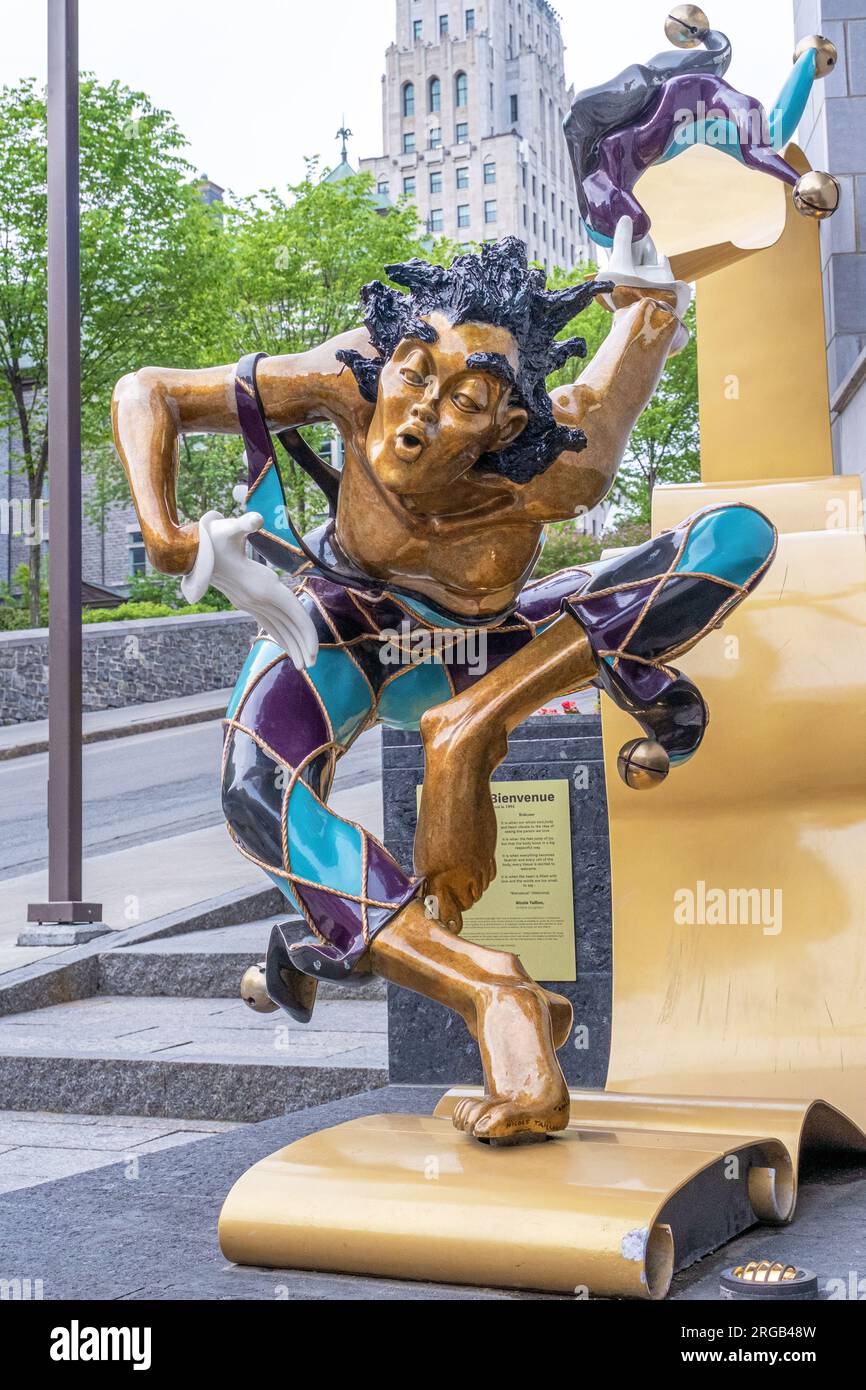Unusual statue of a court jester on a street in Old Quebec City. Stock Photo
