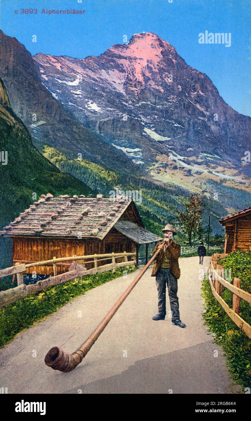 Switzerland - Alpenhorn (Alphorn) - a very long valveless wooden wind instrument played like a horn - used for signalling in the Alps. Stock Photo