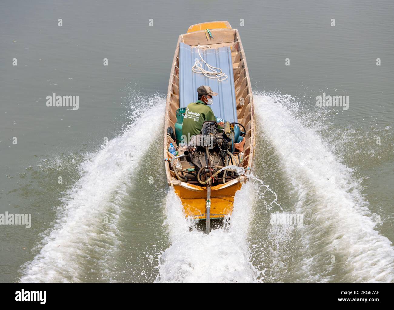 BANGKOK, THAILAND, FEB 23 2023, A traditional transport in Thailand - the boat with long rod of engine, sailing on a water canal. Stock Photo