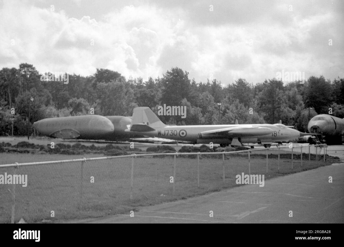 English Electric Canberra B.2 WJ730, on the RAE Farnborough dump in June 1962, after being withdrawn from use by the Empire Test Pilot's School. In the background are de Havilland Comet 1 fuselages and a Britannia fuselage, used in the investigations into the Comet 1 crashes. Stock Photo