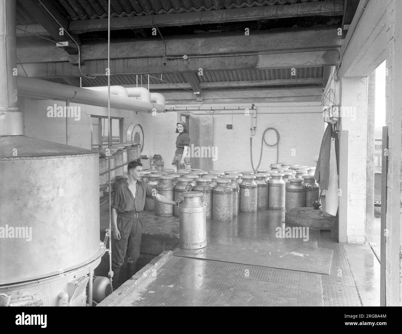 Milk Production in the 1960s: Churn delivery at the dairy Stock Photo