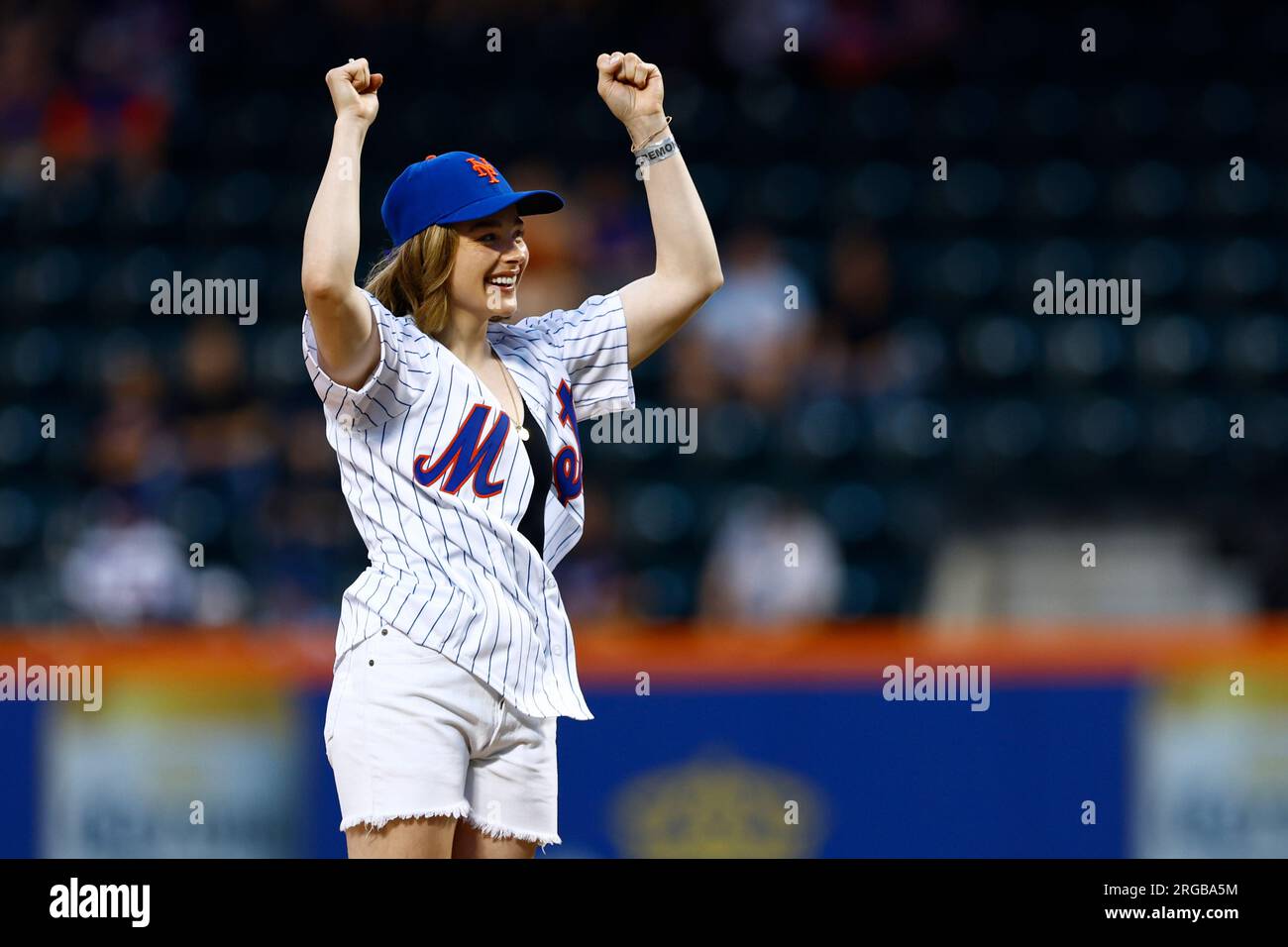Actress Chloe Grace Moretz throws out the first pitch before of a baseball  game between the Chicago Cubs and New York Mets, Monday, Aug.7, 2023, in  New York. (AP Photo/Rich Schultz Stock