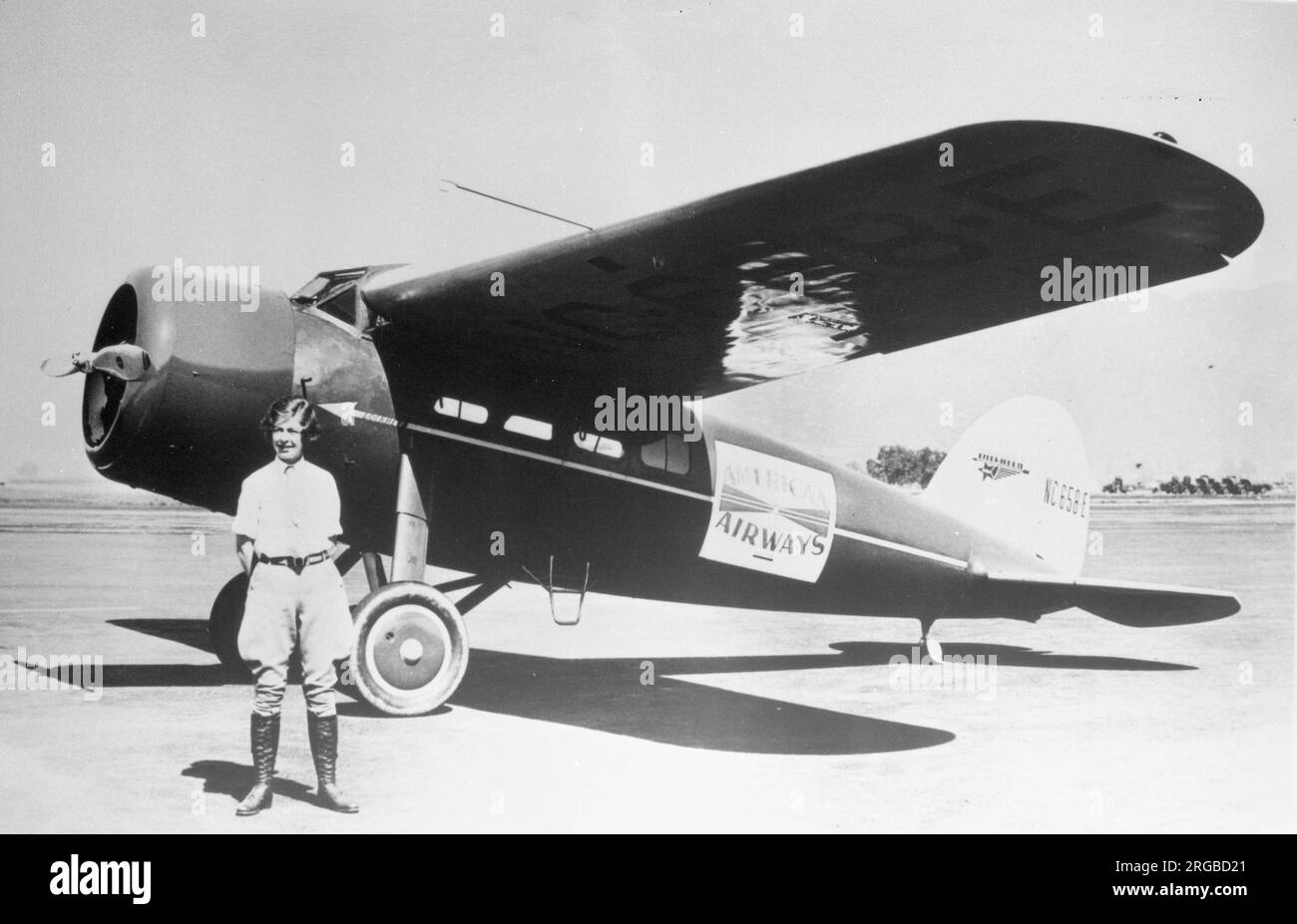 Lockheed Vega 5 NC658E (msn 55), in American Airways livery, with noted aviatrix Elinor Smith, at age 19, standing in front of it. Elinor Smith was the youngest pilot to gain a commercial licence and set a world record , when she was only 16! The connection with the Vega is unknown. Stock Photo
