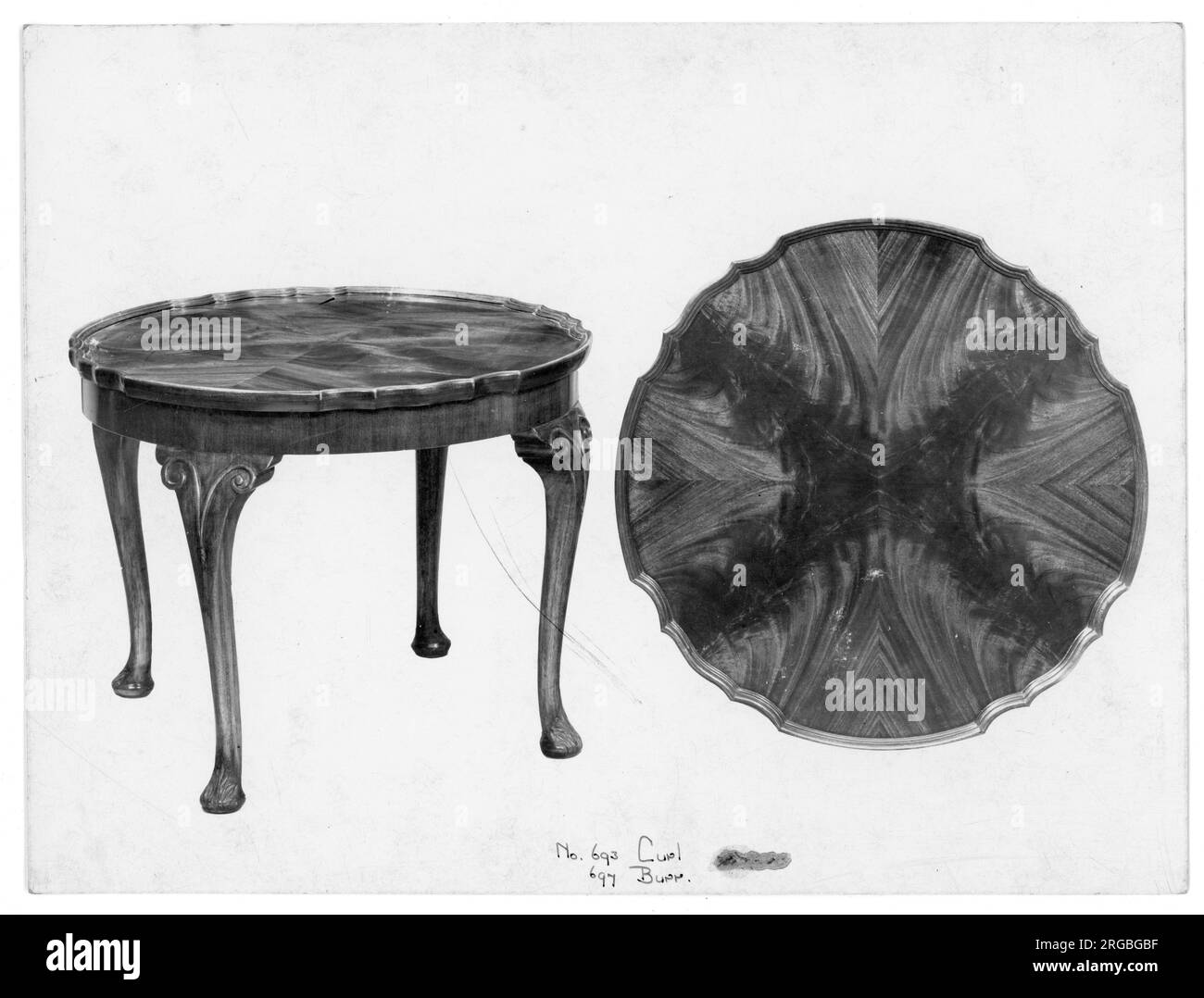 Walnut circular table from a furniture showroom catalogue. Available with Curl cut and Burr cut as number 693 and number 697, respectively. Stock Photo
