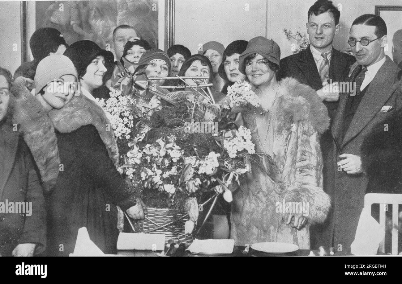 Kate Evelyn 'Ma' Meyrick (1875 -1933), an Irish business woman and 'Queen' of the London nightclub scene welcomed home by staff and members of her family after being released from Holloway Prison in 1930. She ran '43', a late-night jazz club at 43 Gerrard Street in Soho, was prosecuted several times for breaching licensing laws and went to prison for bribing policemen to ignore these breaches. Her book 'Secrets of the 43' was banned on its publication in 1933. Three of her daughters married peers of the realm. Stock Photo