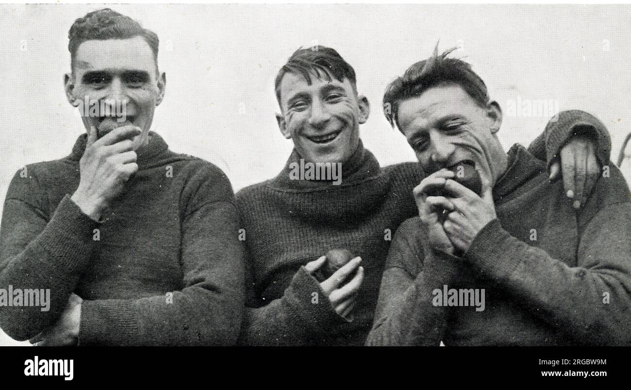 Clapton Orient (later known as Leyton Orient)  players Jones, Fletcher and Ellis enjoying their pre-war keep-fit diet of oranges Stock Photo