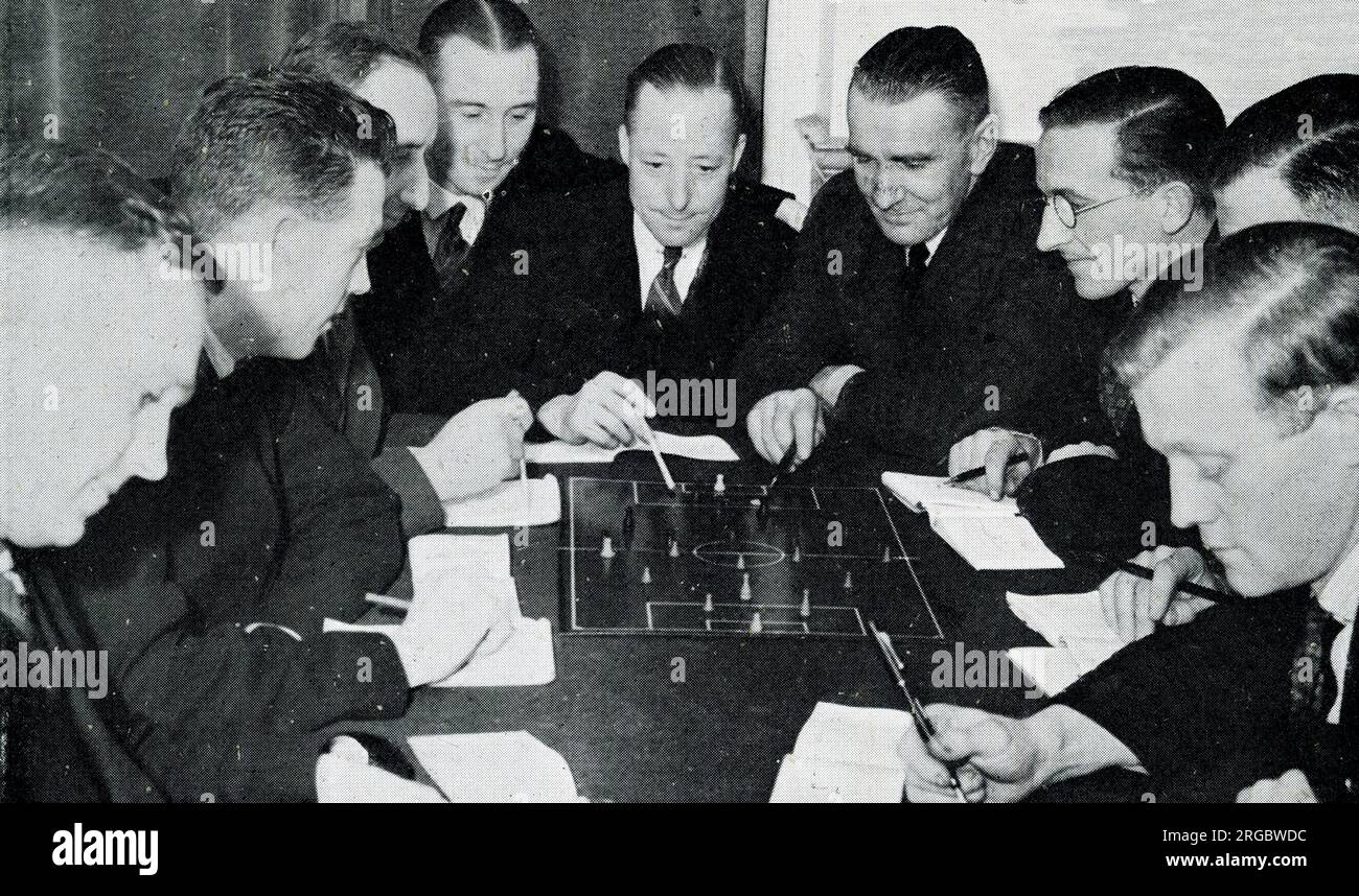 London Association of Referees using tactical table to study the rules of the game Stock Photo