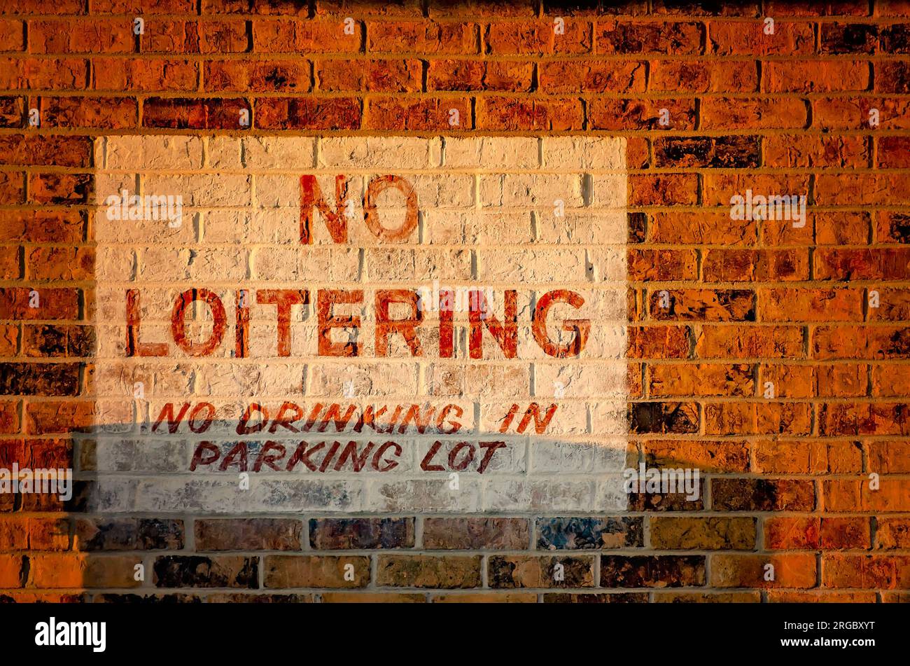 A “No Loitering” sign is painted on the wall at Gran-Pak 2 gas station and convenience store, Aug. 4, 2023, in Grand Bay, Alabama. Stock Photo