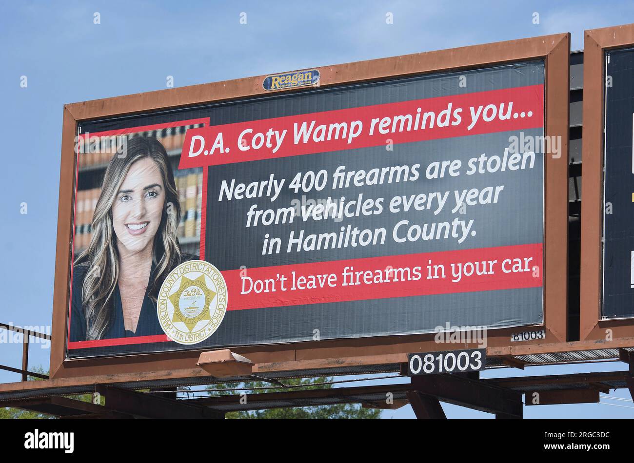 A billboard, featuring District Attorney Coty Wamp, warns of guns 