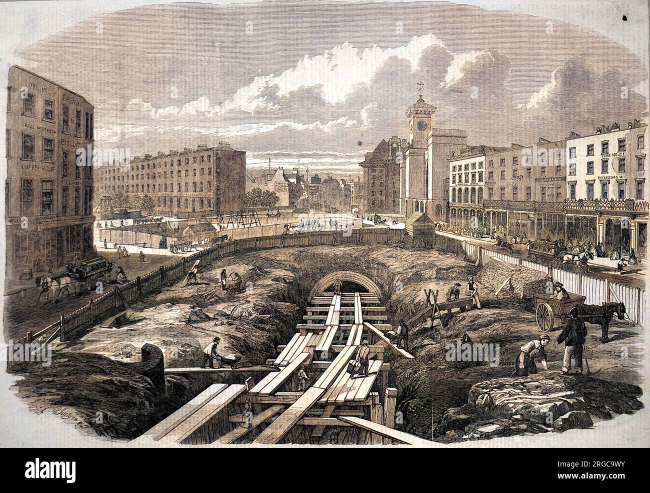 The building work in progress at King's Cross, to host part of the Mertropolitan underground railway. The first section of the underground was completed in 1863, soon to be followed by a extension to Westminster. Both broad gauge and standard gauge track were used. Stock Photo