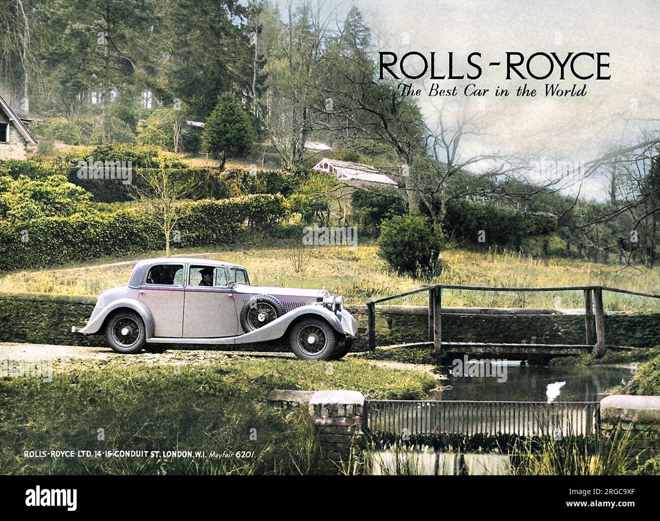 Advertisement for Rolls Royce cars 'the best car in the world'. Photograph of a Rolls Royce being driven by a chauffeur through a pretty rural scene. Stock Photo