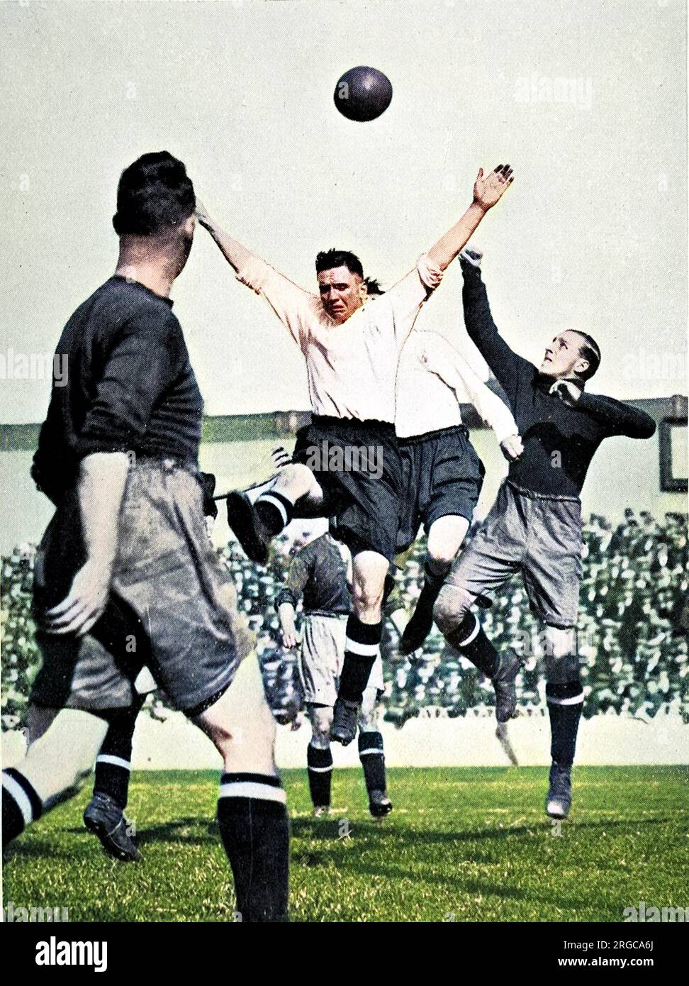 Photograph of a scramble in the goalmouth during a Second Division match between Tottenham Hotspur and Bury, held at White Hart Lane, during the 1929-30 season. The game resulted in a two-all draw. Stock Photo