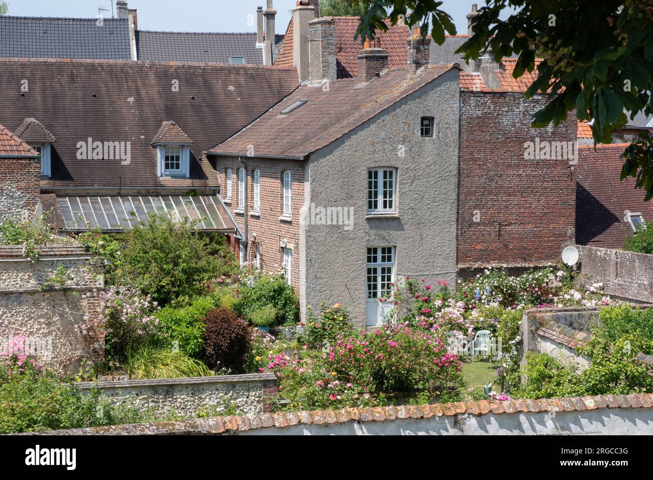 House with a pretty garden within the ramparts at Montreuil-sur-Mer Stock Photo
