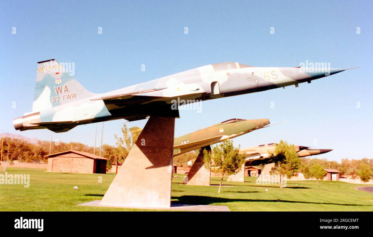 Northrop F-5E Tiger II 74-1571 (MSN R.1269) mounted on a pylon at Freedom Park, Nellis AFB, Nevada, with F-100D 55-3595, F-105F 63-8276 and F-111A 67-0100. Stock Photo