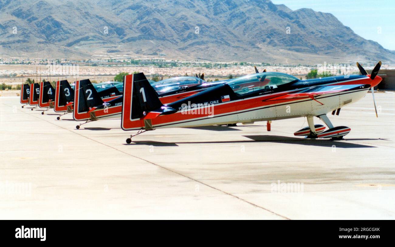 Fuerza Aerea de Chile - Extra EA.300-L 149 - '1' (msn 149), of La Escuadrilla de alta acrobacia Halcones, with the other aircraft of the team, at the Nellis Air Force Base '50th Anniversary of the USAF' airshow on 26 April 1997. (Fuerza Aerea de Chile - Chilean Air Force) Stock Photo