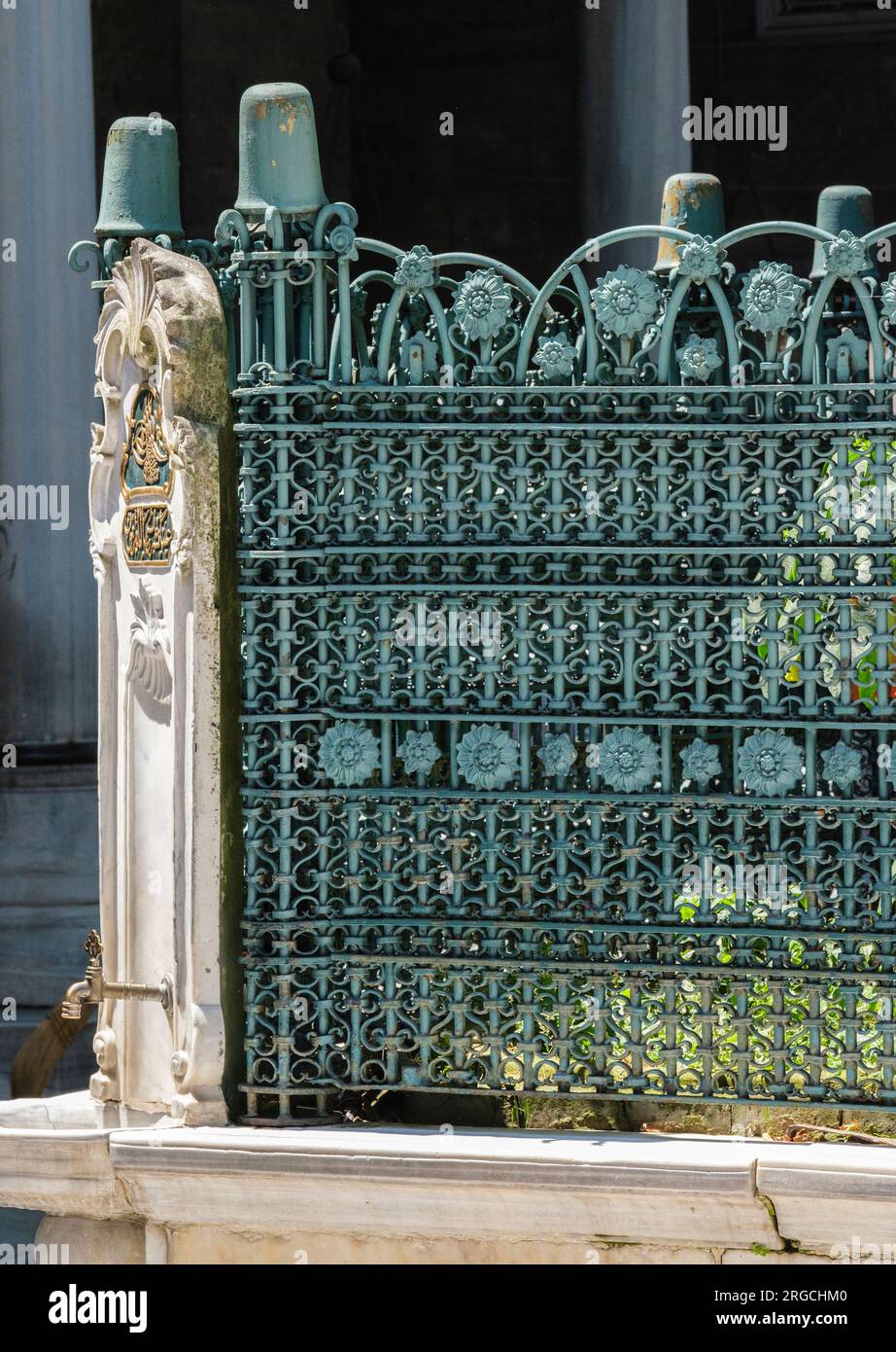 Istanbul, Turkey, Turkiye. Eyup Sultan Mosque, Decorative Grillwork in the Courtyard, Water Faucet on left. Stock Photo