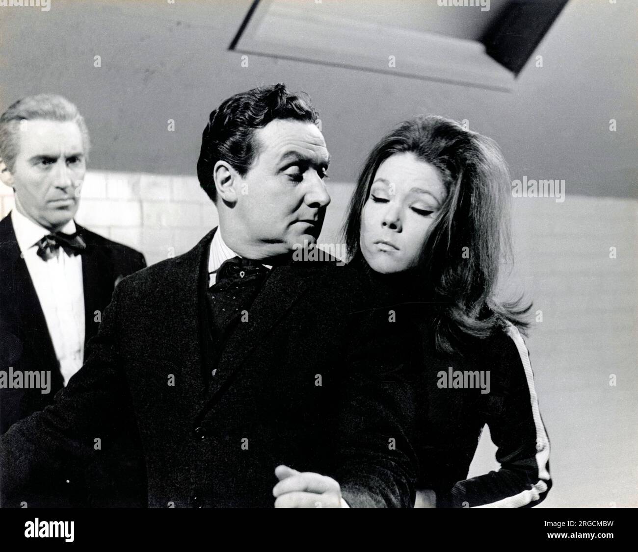 Emma Peel of 'The Avengers', with John Steed and one other played by Diana Rigg, Patrick McNee and an unknown actor, respectively. Stock Photo