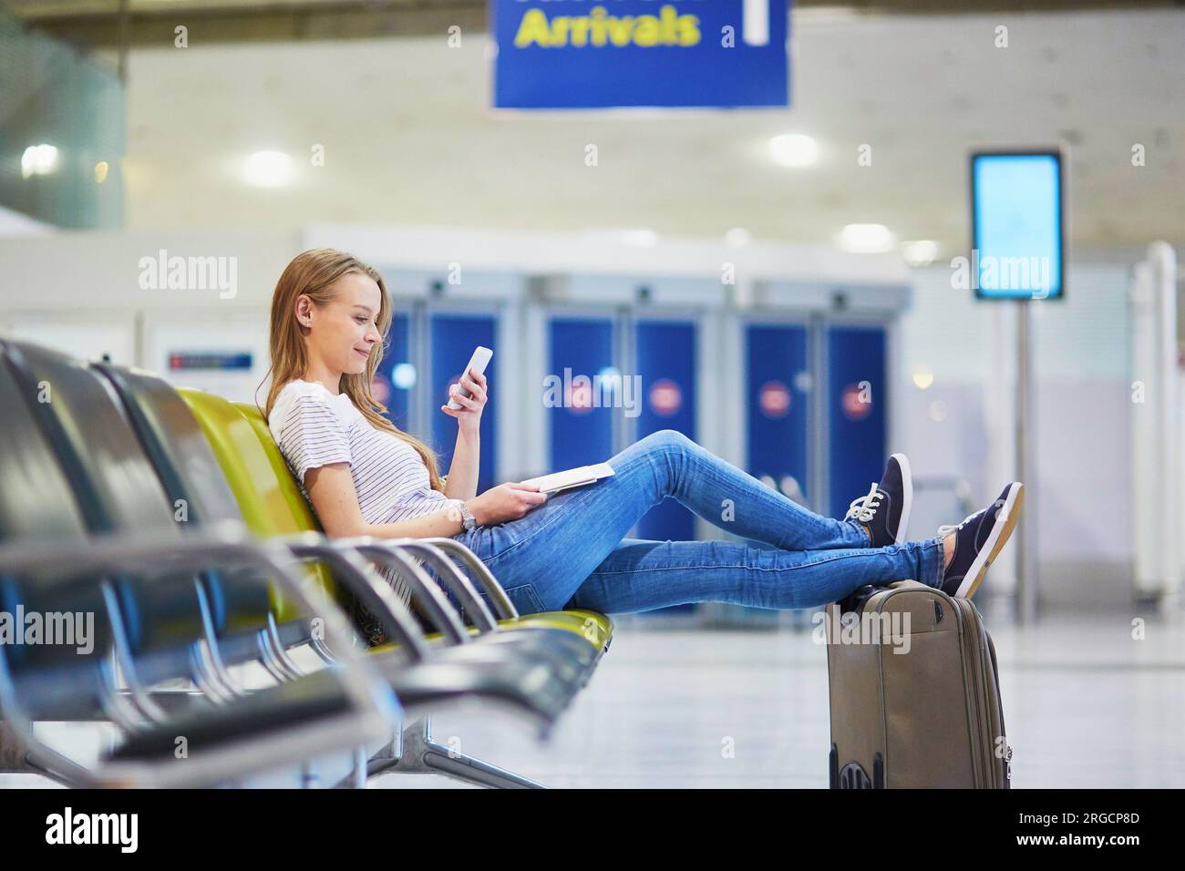 Airport reading book hi-res stock photography and images - Alamy