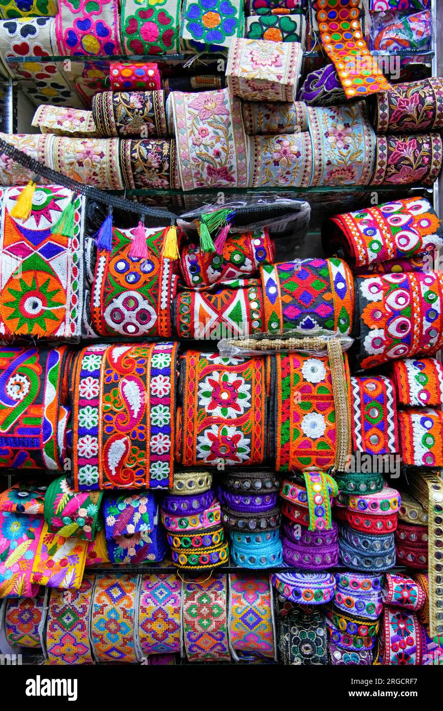 Colourful ethnic embroidered fringing in a haberdasher's shop in Jeddah, Saudi Arabia Stock Photo