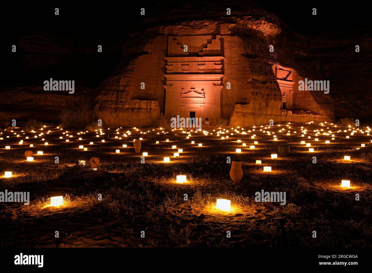 Hegra ancient tombs illuminated by candle light, Alula, Saudi Arabia Stock Photo