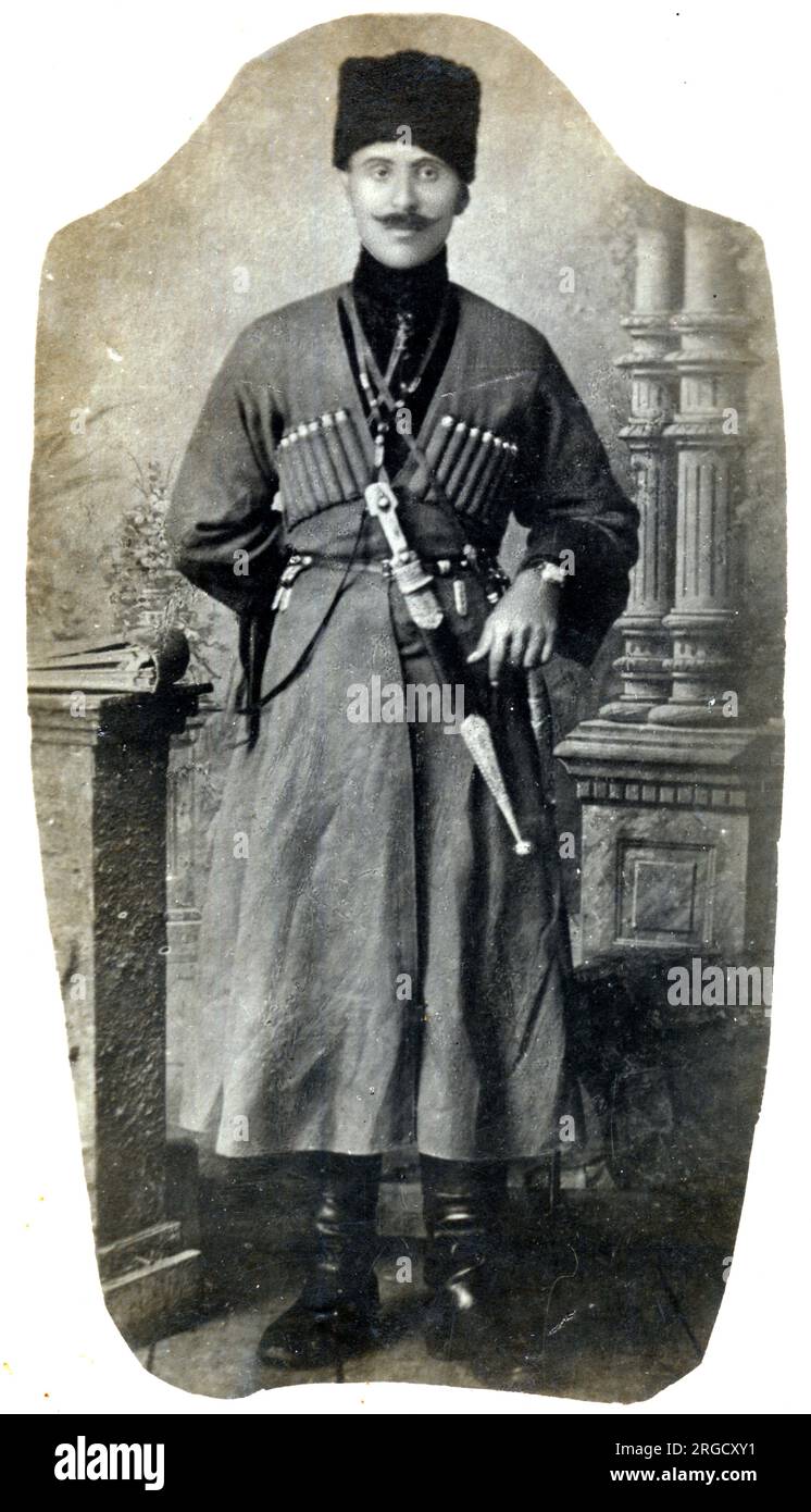 A full-length photographic portrait of the Commander of the 11th Kafkas Regiment (3rd Platoon) - shown year in more traditional military costume circa 1900. The Islamic Army of the Caucasus (Turkish: Kafkas Islam Ordusu) was a military unit of the Ottoman Empire formed on July 10, 1918. The Ottoman Minister of War, Enver Pasha, ordered its establishment, and it played a major role during the Caucasus Campaign of World War I. Stock Photo