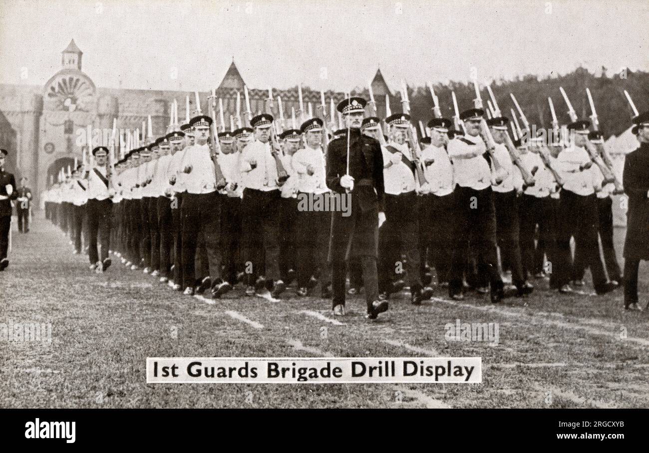 The 1st Guards Brigade Drill Display at the Aldershot Military Tattoo, an annual event dating back to 1894. In the 1920s and 1930s, the Aldershot Command Searchlight Tattoo held at the Rushmoor Arena presented displays from all branches of the services, including performances lit by flame torches. At one time the performances attracted crowds of up to 500,000 people. Stock Photo