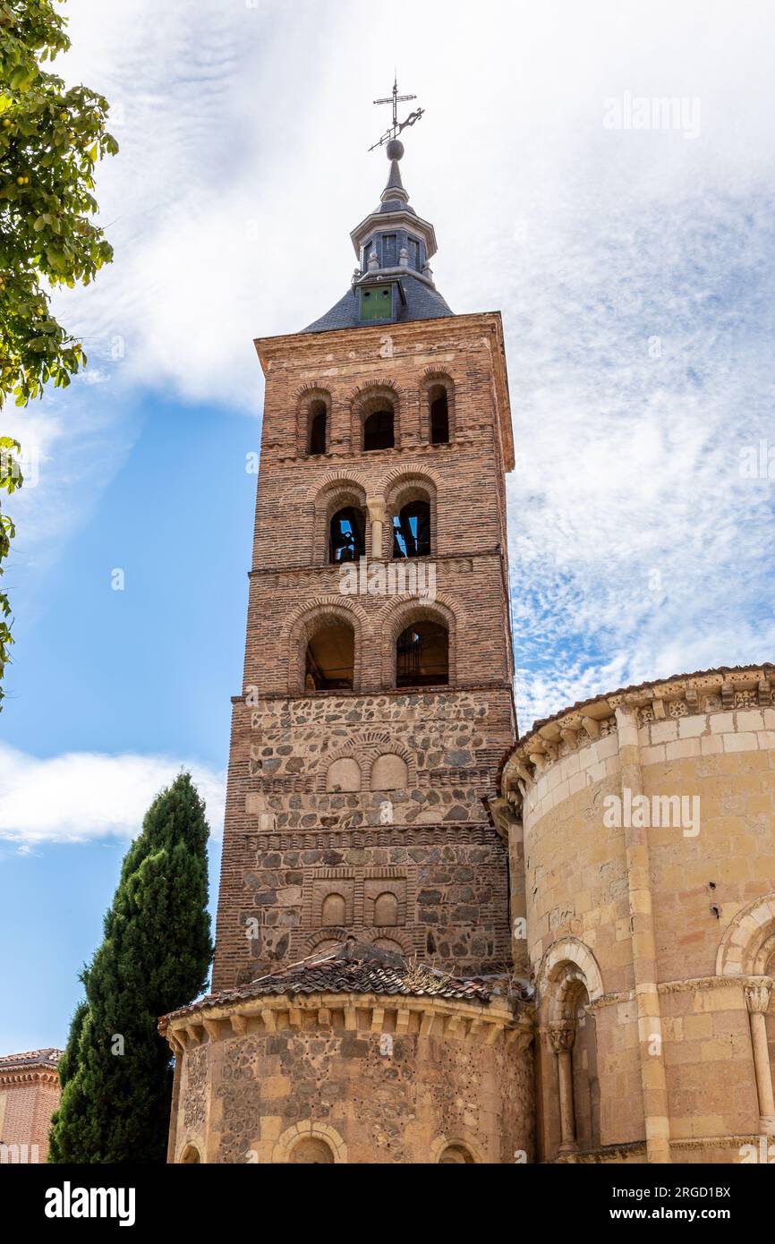 Iglesia de San Martín (Church of San Martín) Romanesque - Mudejar style bell tower with brick arches on stone columns and weather vane, Segovia, Spain Stock Photo