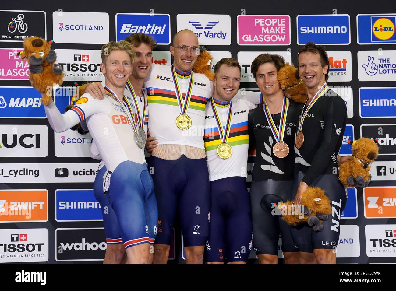 The Netherlands' Jan Willem van Schip and Yoeri Havik (centre) celebrate winning gold in the Elite Men's Madison alongside Great Britain's Mark Stewart and Oliver Wood with the silver medal (left) and New Zealand's Aaron Gate and Campbell Stewart with bronze during day six of the 2023 UCI Cycling World Championships at the Sir Chris Hoy Velodrome, Glasgow. Picture date: Tuesday August 8, 2023. Stock Photo