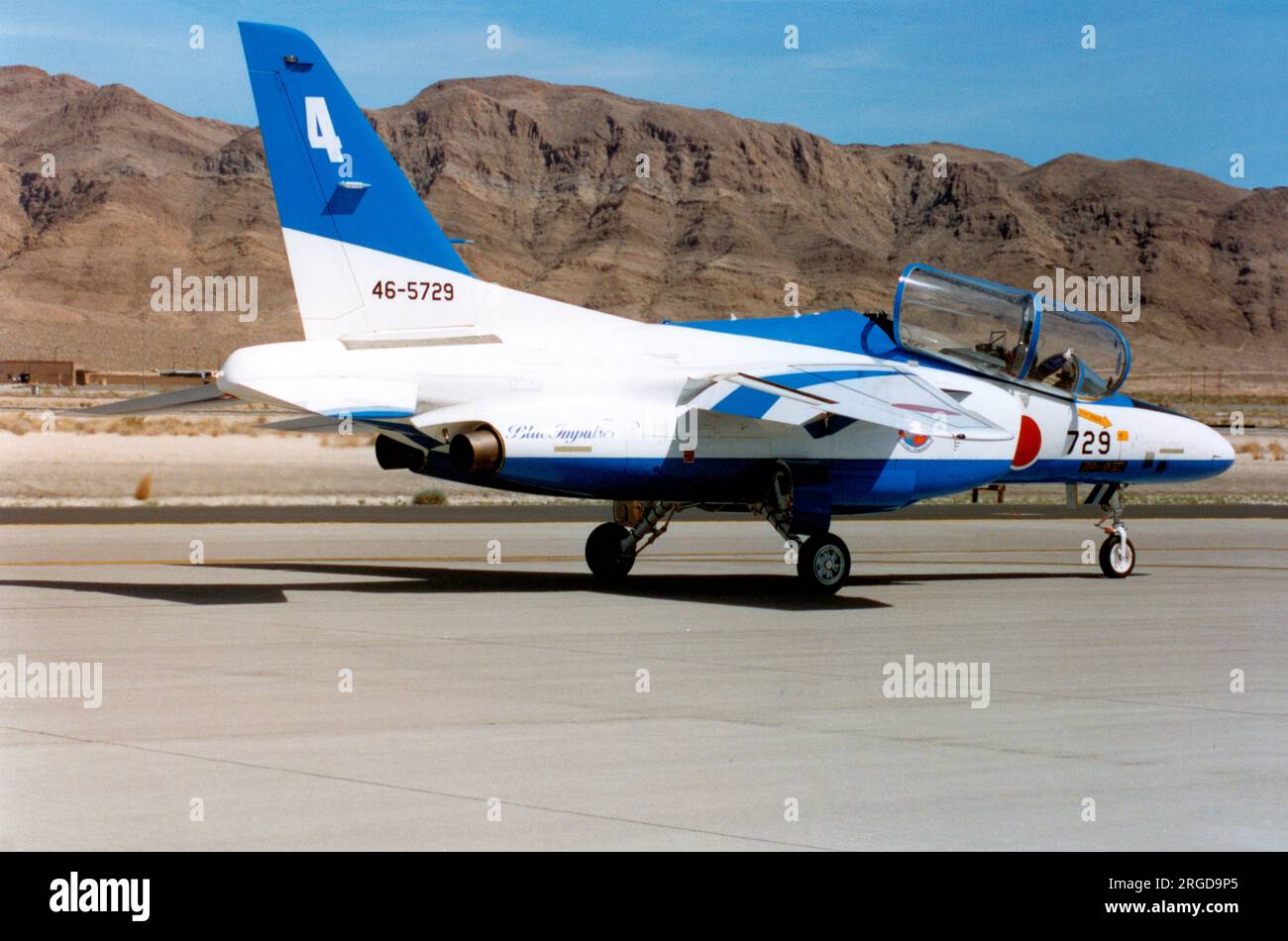 Japan Air Self Defence Force - Kawasaki T-4 46-5729 / number 4 (msn 1129), of the Blue Impulse aerobatic display team, at the Nellis Air Force Base '50th Anniversary of the USAF' airshow on 26 April 1997. Stock Photo