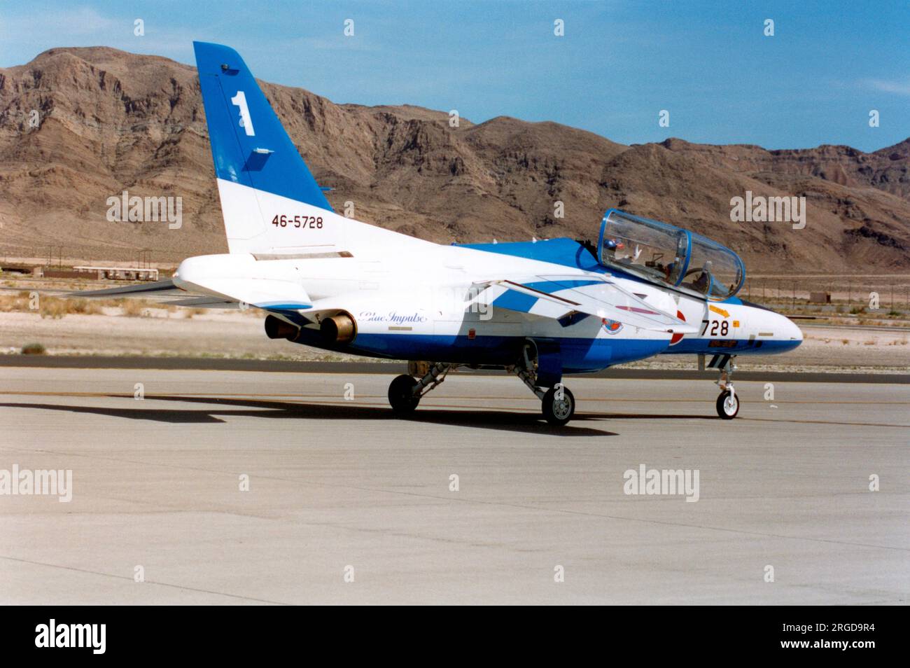 Japan Air Self Defence Force - Kawasaki T-4 46-5728 / number 1 (msn 1128), of the Blue Impulse aerobatic display team, at the Nellis Air Force Base '50th Anniversary of the USAF' airshow on 26 April 1997. Stock Photo