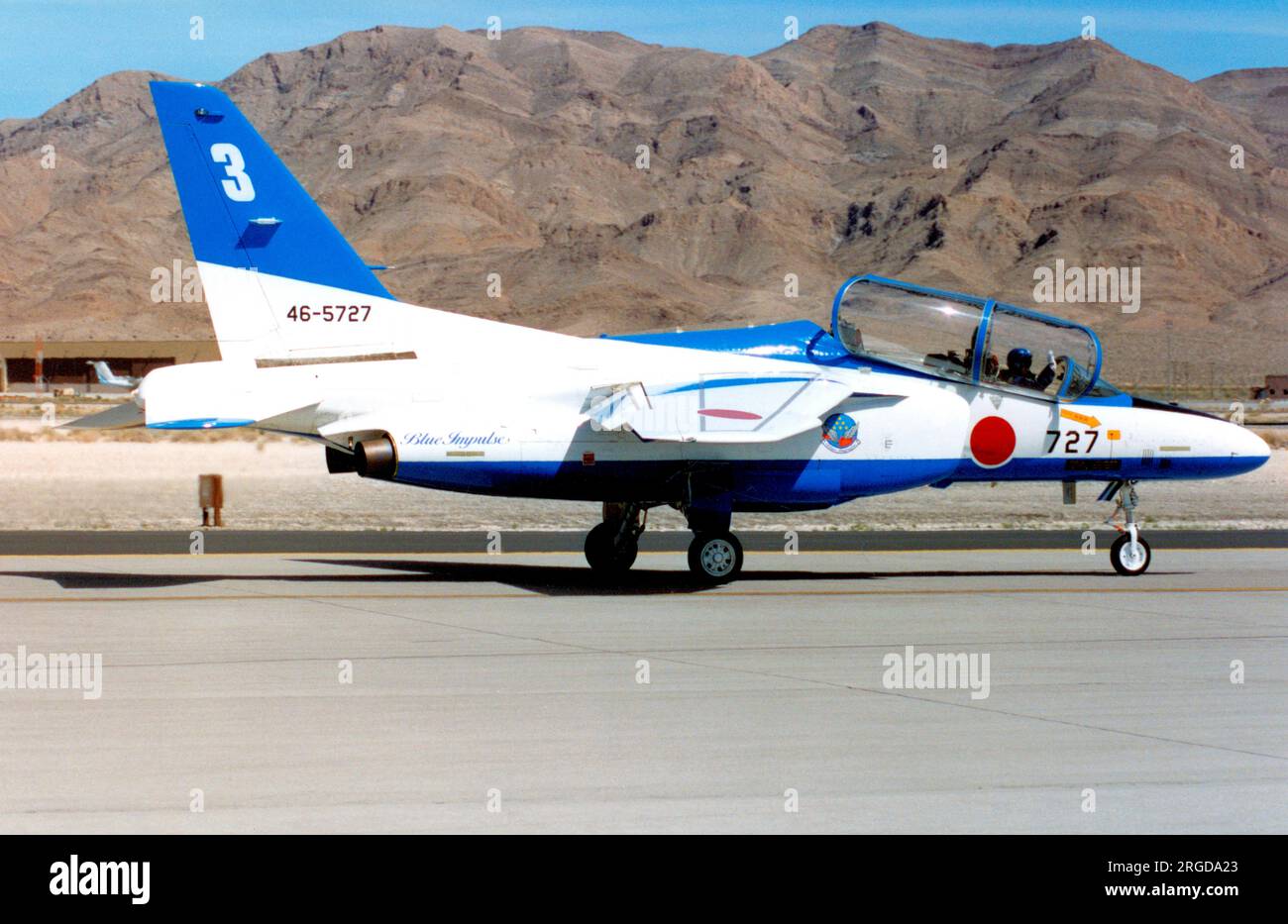 Japan Air Self Defence Force - Kawasaki T-4 46-5727 / number 3 (msn 1127), of the Blue Impulse aerobatic display team, at the Nellis Air Force Base '50th Anniversary of the USAF' airshow on 26 April 1997. Stock Photo